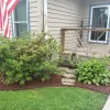 Red Rubber Mulch Garden Bed Front of House