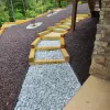 Backyard Pathway With Rubber Mulch Landscaping