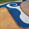 Blue rubber mulch design around a pool