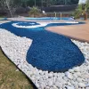 Blue rubber mulch and stone landscaping design