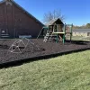Brown Rubber Mulch Ground Surfacing on a Playground