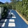Long path with blue rubber mulch