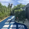 Stone paver path with blue rubber mulch fill