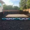 Sandbox with rubber mulch surrounding