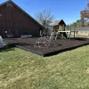 Playground Ground Surface of Brown Rubber Mulch and DuraTimber Borders 