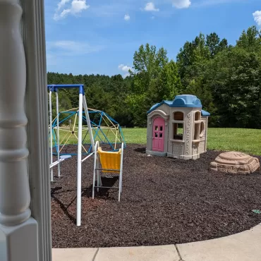 Playground with brown rubber mulch surfacing