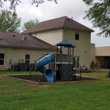 Playground with brown rubber mulch ground covering