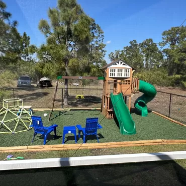 Playground with green rubber mulch ground cover