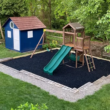 Playground with black rubber mulch surfacing