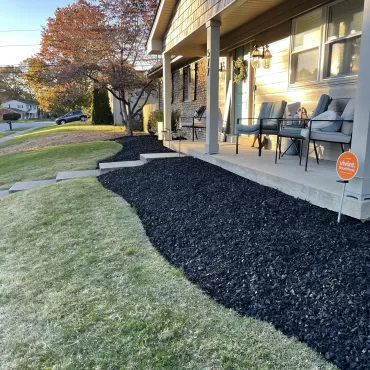 Black rubber mulch around new house