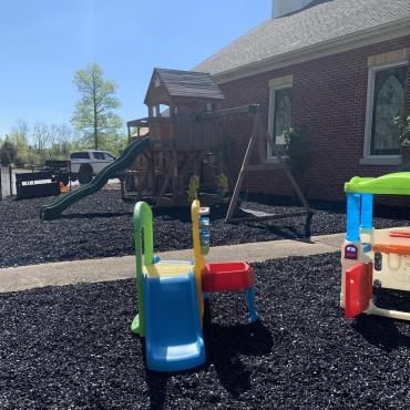 Church playground with black rubber mulch