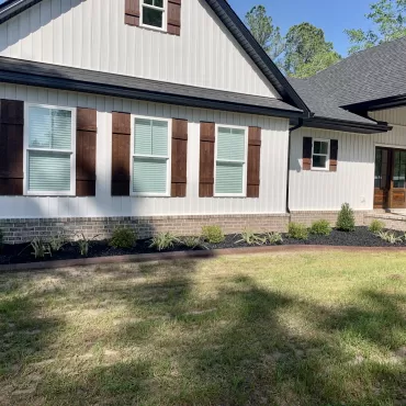 Front of house with black landscaping rubber mulch