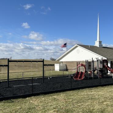 Black rubber mulch ground cover used in church playground
