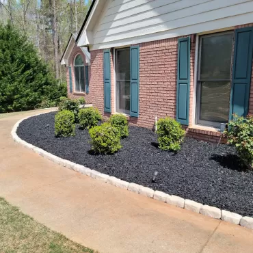 Front of house plant beds with rubber mulch