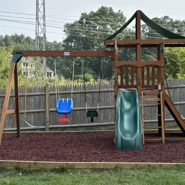 Swing Set with Red Rubber Mulch Safety Surfacing