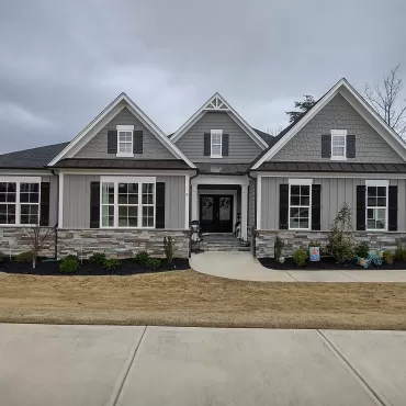Rubber mulch landscaping in front of quaint home