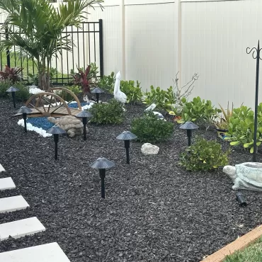 Brown Rubber Mulch in Backyard Landscaping