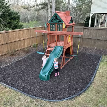 Brown Rubber Mulch Playground in Backyard