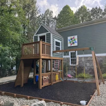 Playground with brown rubber mulch ground cover