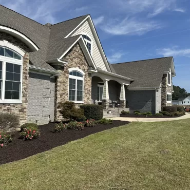 Large landscaping project with brown rubber mulch