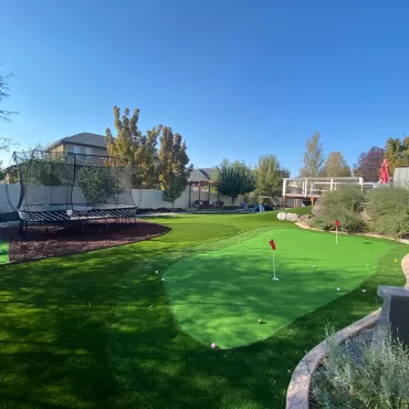 Rubber Mulch Under Trampoline in Fun Backyard