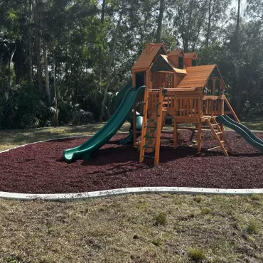 Playground with red rubber mulch