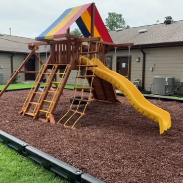 AFTER - Playground Makeover With Red Rubber Mulch