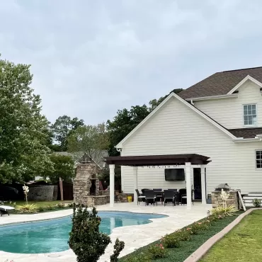 Green rubber mulch edging around a pool