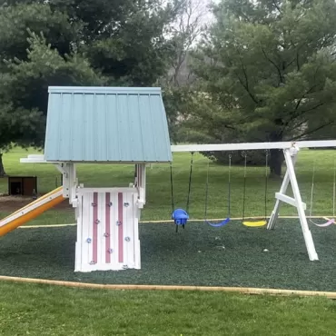 Playground with green rubber mulch ground cover