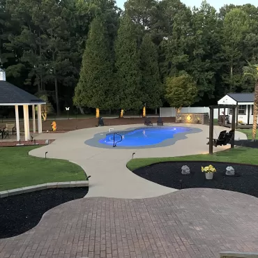 Black Rubber Mulch Pool Landscaping After Photo
