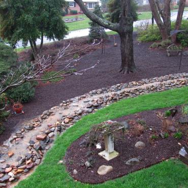 Brown Rubber Mulch Landscaping With a Creek