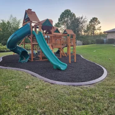Playground with brown rubber mulch surface