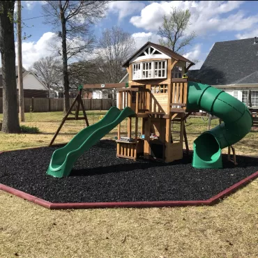 Playground with rubber mulch and hexagon border