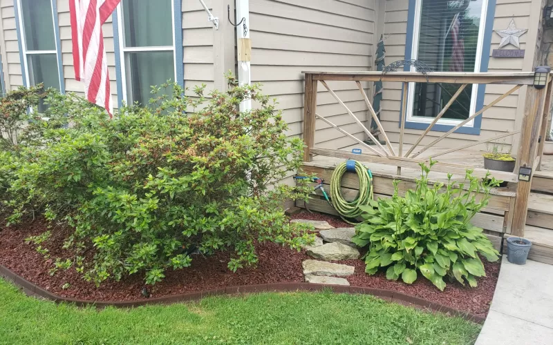 Red Rubber Mulch Garden Bed Front of House
