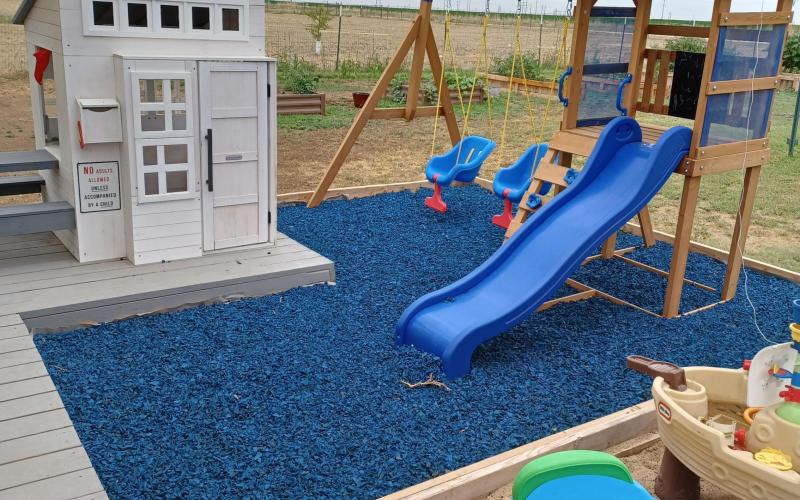 Playground with blue rubber mulch 