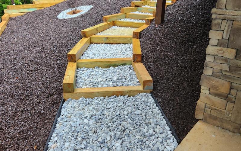 Backyard Pathway With Rubber Mulch Landscaping