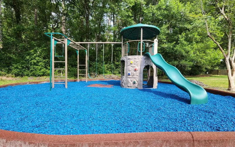 Playground with blue rubber mulch
