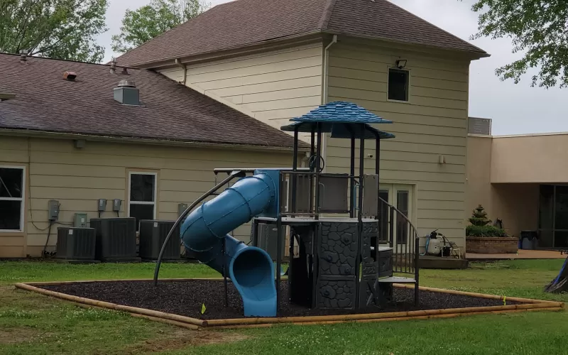 Playground with brown rubber mulch ground covering