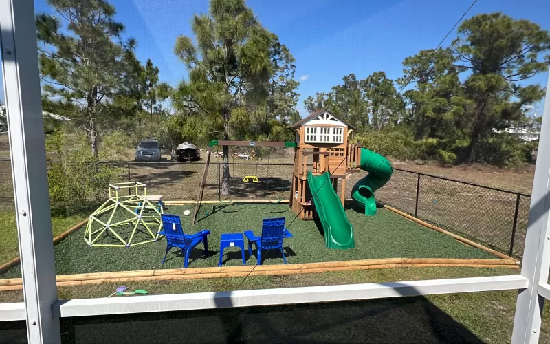 Playground with green rubber mulch ground cover