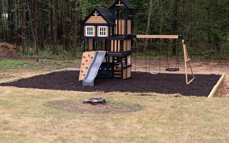 Playground with Brown Rubber Mulch Playground with Brown Rubber Mulch