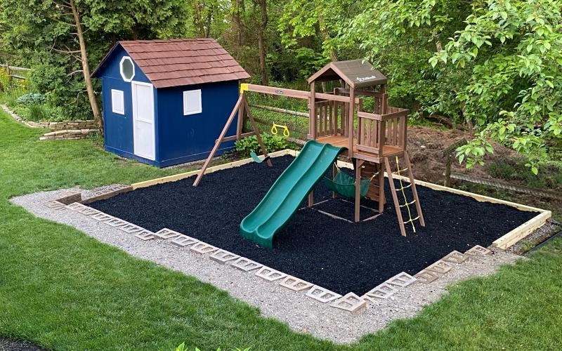 Playground with black rubber mulch surfacing