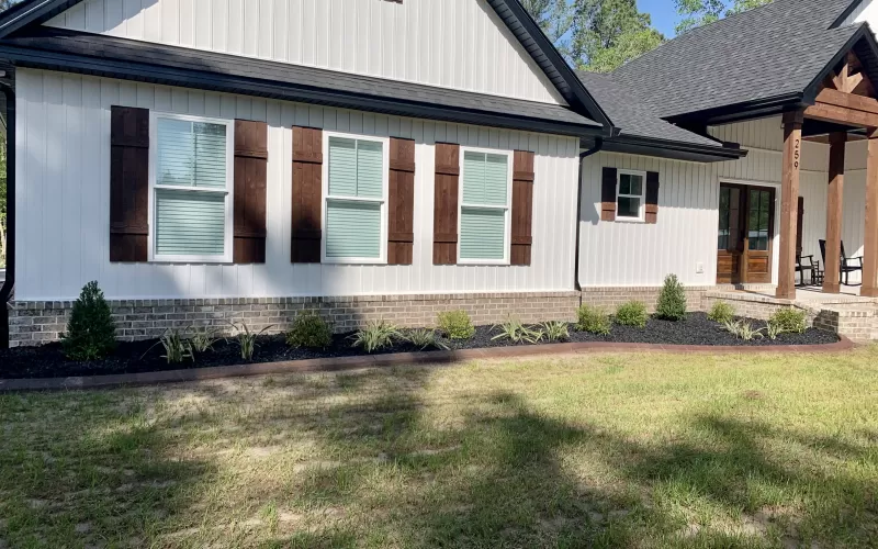 Front of house with black landscaping rubber mulch