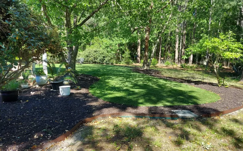 Back Yard Brown Rubber Mulch Landscaping