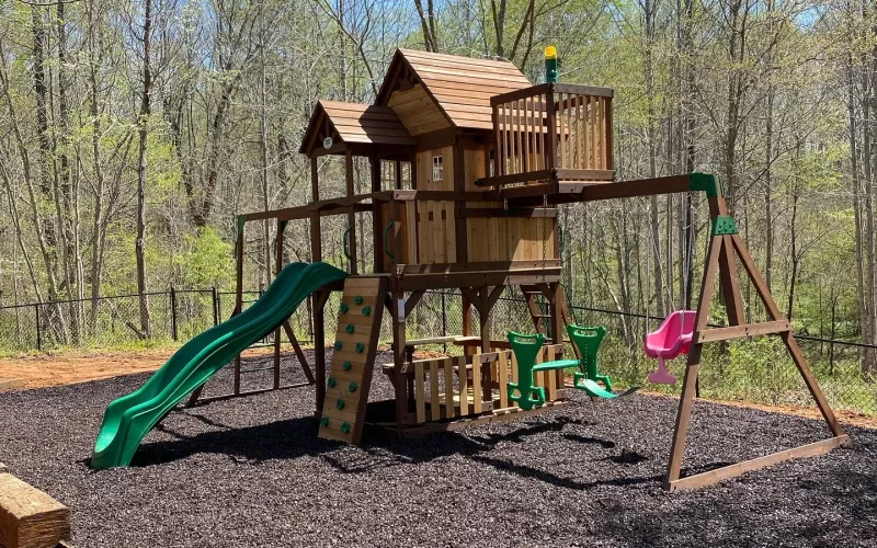 New Playground With Brown Rubber Mulch Surfacing