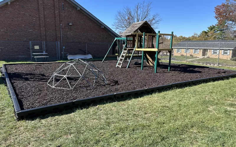 Brown Rubber Mulch Ground Surfacing on a Playground