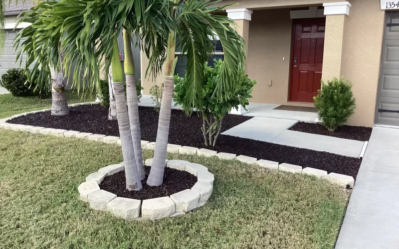 Brown Rubber Mulch Retained with White Rock Edging
