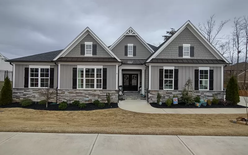 Rubber mulch landscaping in front of quaint home