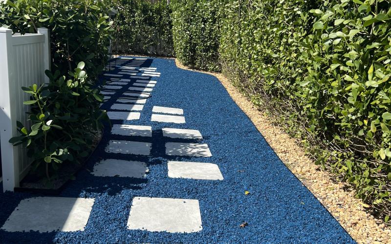 Long path with blue rubber mulch