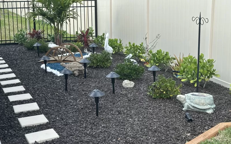 Brown Rubber Mulch in Backyard Landscaping