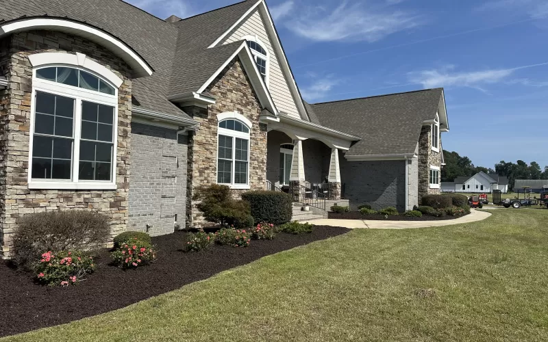 Large landscaping project with brown rubber mulch